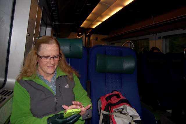 Bev Checking Out the Bus and Train Schedule