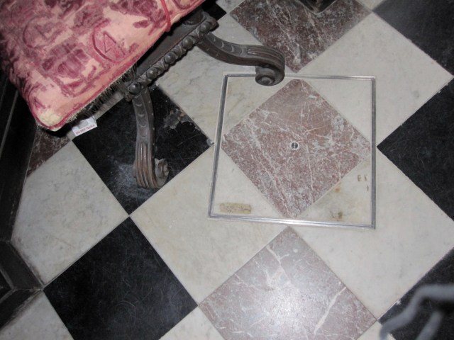 Tile covered opening to basement for transmission of sound